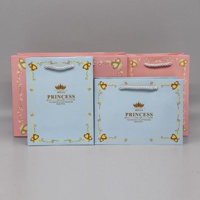 comprar Bolsa de papel de compras reutilizable de impresión personalizada de varios colores con mango retorcido online manufacture