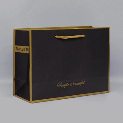 Bolsa de papel artesanal de papel negro de papel y logotipo de golpe Reutilizable mango retorcido 300g